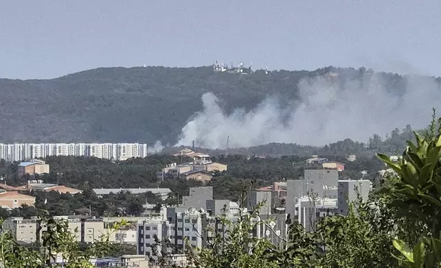 Smoke rises from a mountain in Pohang, South Korea, where a Navy patrol plane carrying four people crashed on Thursday, May 29, 2025. (Son Dae-seong/Yonhap via AP)