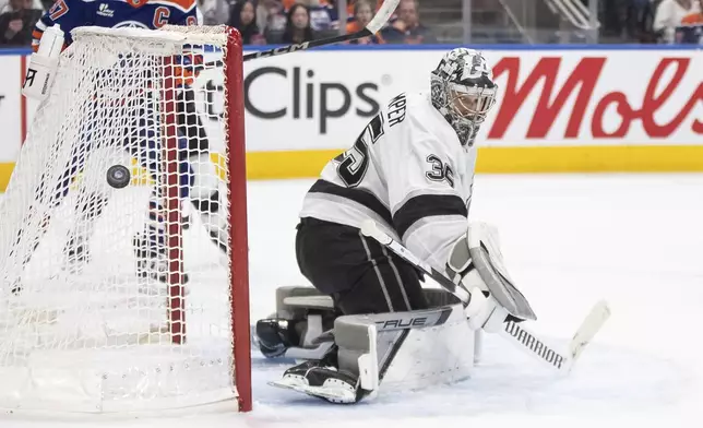 Los Angeles Kings goalie Darcy Kuemper (35) makes a save against the Edmonton Oilers during the second period of an NHL hockey game in Edmonton, Alberta, Thursday, May 1, 2025. (Jason Franson/The Canadian Press via AP)