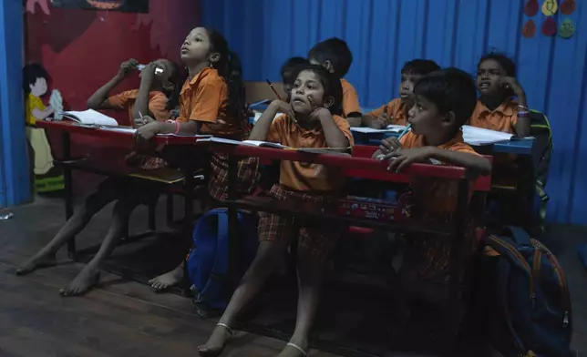Students react during a math lesson at the Signal Shala school in Thane near Mumbai, India, April 9, 2025. (AP Photo/Rafiq Maqbool)