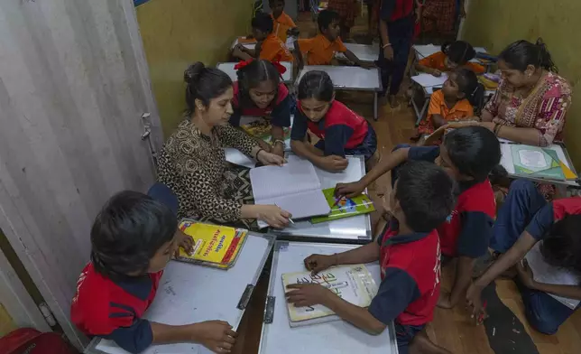 Students attend a Marathi language class at the Signal Shala school in Thane near Mumbai, India, April 3, 2025. (AP Photo/Rafiq Maqbool)