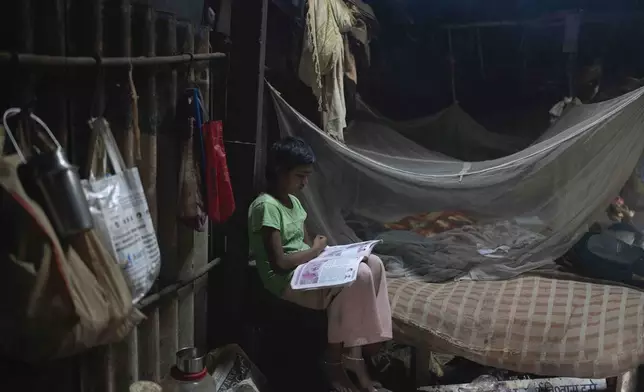 Neelam Krishan, 11, studies at her home in Thane near Mumbai, India, April 9, 2025. (AP Photo/Rafiq Maqbool)