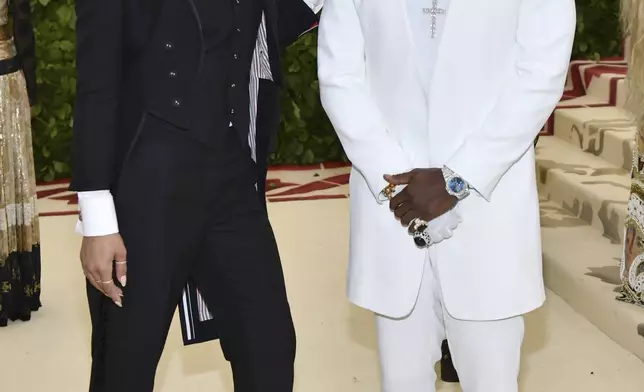 Sean Combs, right, and Cassie Ventura, attend The Metropolitan Museum of Art's Costume Institute benefit gala celebrating the opening of the Heavenly Bodies: Fashion and the Catholic Imagination exhibition, May 7, 2018, in New York. (Photo by Charles Sykes/Invision/AP)