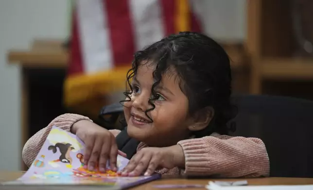A 4-year-old Mexican girl, who has short bowel syndrome, attends a news conference in Los Angeles, Wednesday, May 28, 2025, after her and her mother's humanitarian parole was terminated and they were ordered to self-deport. (AP Photo/Jae C. Hong)