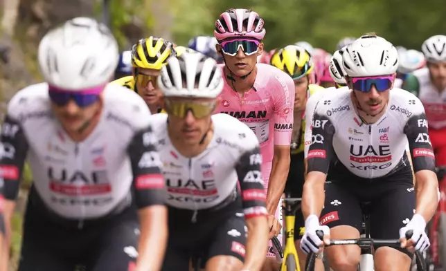 Mexico's Isaac Del Toro Romero, centre, competes during the stage 15 of the Giro d'Italia from Fiume Veneto to Asiago, Italy, Sunday, May 25, 2025. (Fabio Ferrari/LaPresse via AP)