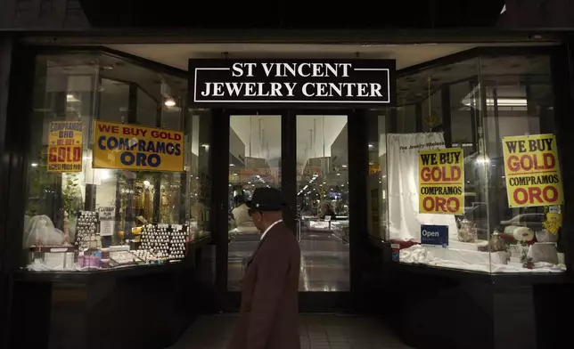 A pedestrian walks past the St. Vincent Jewelry Center in the Jewelry District of Los Angeles, Friday, May 2, 2025. (AP Photo/Jae C. Hong)