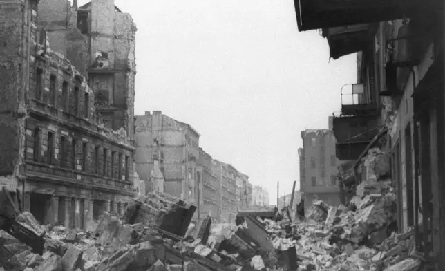 FILE - Wreckage and debris fill Frankfurter Allee near Lasdehner Strasse in a working district in the eastern section of Berlin on July 31, 1945, following an allied aerial attack on Feb. 26, 1945, prior to the fall of the city. (AP Photo, File)