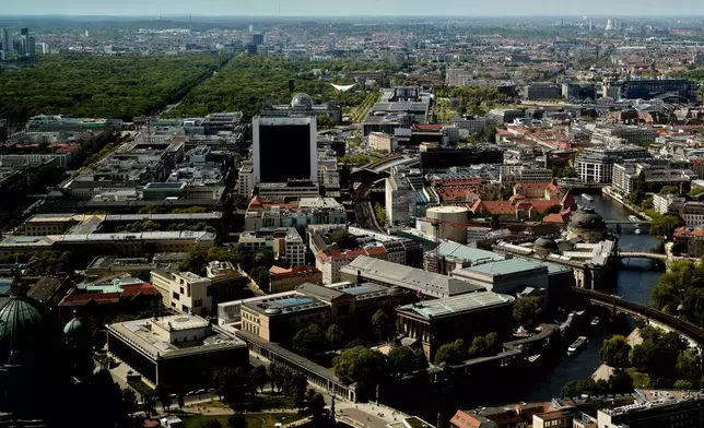 A aeriel view of the area around the Reichstag Building with the glass dome, at center top, of Berlin, Germany, Tuesday, April 29, 2025. (AP Photo/Markus Schreiber)