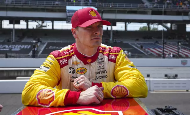 Josef Newgarden watches as his team tows his car following practice for the Indianapolis 500 auto race at the Indianapolis Motor Speedway in Indianapolis, Monday, May 19, 2025. (AP Photo/Michael Conroy)