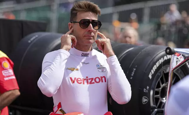 Will Power, of Australia, watches as he waits for is turn during qualification for the Indianapolis 500 auto race at Indianapolis Motor Speedway in Indianapolis, Saturday, May 17, 2025. (AP Photo/Michael Conroy)