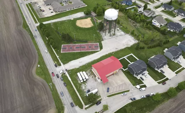 An overhead view shows the scene where victims were killed when a car barreled through a building used for an after-school camp, Tuesday, April 29, 2025, in Chatham, Ill. (AP Photo/Erin Hooley)