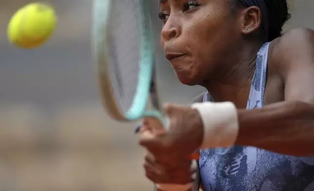 Coco Gauff of the U.S. returns the ball to Australia's Olivia Gadecki during their first round match of the French Tennis Open, at the Roland-Garros stadium, in Paris, Tuesday, May 27, 2025. (AP Photo/Thibault Camus)