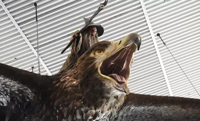 A sculpture of an eagle from the Hobbit films, ridden by the wizard Gandalf, hangs over the food court area of Wellington Airport, in Wellington, New Zealand, Monday, May 5, 2025. (AP Photo/Charlotte Graham-McLay)