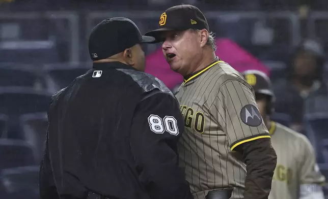 San Diego Padres manager Mike Shildt, right, argues with umpire Adrian Johnson, left, during the eighth inning of a baseball game against the New York Yankees, Monday, May 5, 2025, in New York. (AP Photo/Pamela Smith)
