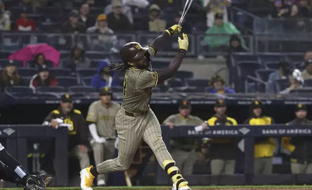 San Diego Padres' Fernando Tatis Jr. strikes out during the eighth inning of a baseball game against the New York Yankees Monday, May 5, 2025, in New York. (AP Photo/Pamela Smith)