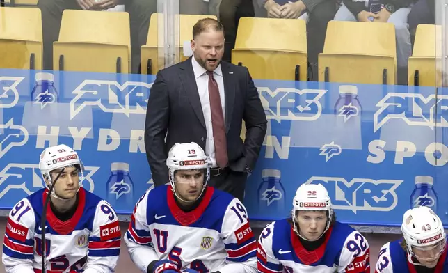 Ryan Warsofsky, head coach of USA national ice hockey team looks on, during the IIHF 2025 World Championship preliminary round group B game between Kazakhstan and USA, at the Jyske Bank Boxen, in Herning, Denmark, Sunday, May 18, 2025. (Salvatore Di Nolfi/Keystone via AP)