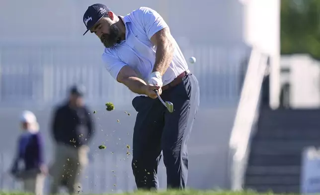 Former Philadelphia Eagles football player Jason Kelce hits on the 16th hole during a pro-am before the Truist Championship golf tournament at the Philadelphia Cricket Club, Wednesday, May 7, 2025, in Flourtown, Pa. (AP Photo/Matt Rourke)