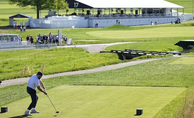 Former Philadelphia Eagles football player Jason Kelce hits on the 17th hole during a pro-am before the Truist Championship golf tournament at the Philadelphia Cricket Club, Wednesday, May 7, 2025, in Flourtown, Pa. (AP Photo/Matt Rourke)