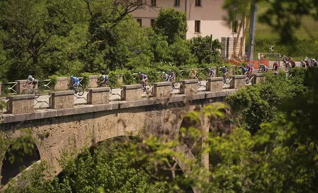 The pack rides during the 8th stage of the Giro d'Italia from Giulianova to Castelraimondo, Italy, Saturday May 17, 2025. (Marco Alpozzi/LaPresse via AP)
