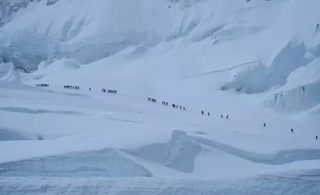 Mountaineers ascend to Camp 2 on their way to the summit of Mount Everest in Nepal, May 1, 2025. (AP Photo/Pasang Rinzee Sherpa)