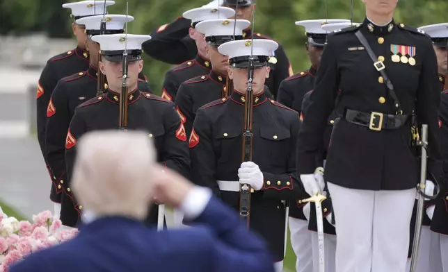 President Donald Trump salutes during a Memorial Day wreath laying ceremony at Arlington National Cemetery, in Arlington, Va., Monday, May 26, 2025. (AP Photo/Jacquelyn Martin)