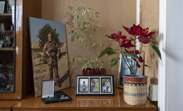 A portrait of Ukrainian soldier Serhii Hryhoriev, who died in Russian captivity, is displayed in his family's house in Pyriatyn, Ukraine, March 9, 2025. (AP Photo/Alex Babenko)
