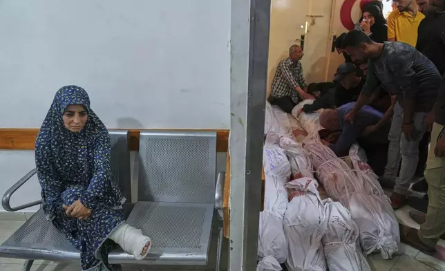 Palestinians mourn their relatives killed in an Israeli airstrikes in Jabalia, northern Gaza Strip, on Wednesday, May 14, 2025. According to local hospitals, 48 people were killed in the strikes, including 22 children. (AP Photo/Jehad Alshrafi)
