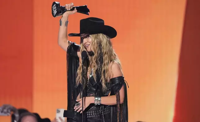 Lainey Wilson accepts the award for female artist of the year during the 60th annual Academy of Country Music Awards on Thursday, May 8, 2025, in Frisco, Texas. (AP Photo/Chris Pizzello)