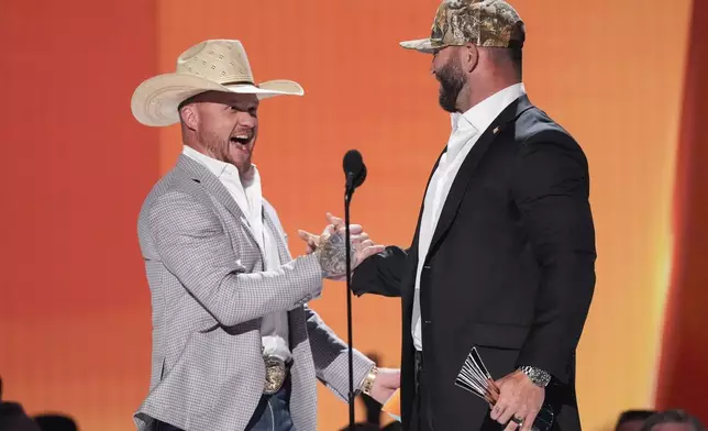Cody Johnson, left, and Josh Phillips accept the award for song of the year for "Dirt Cheap" during the 60th annual Academy of Country Music Awards on Thursday, May 8, 2025, in Frisco, Texas. (AP Photo/Chris Pizzello)