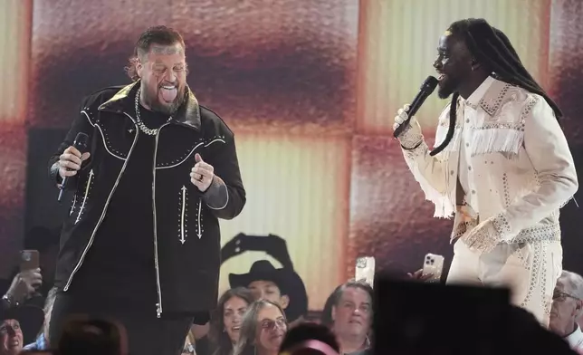 Jelly Roll, left, and Shaboozey perform "Amen" during the 60th annual Academy of Country Music Awards on Thursday, May 8, 2025, in Frisco, Texas. (AP Photo/Chris Pizzello)
