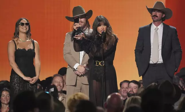 Riley Green, second left, and Ella Langley accept the award for music event of the year for "you look like you love me" during the 60th annual Academy of Country Music Awards on Thursday, May 8, 2025, in Frisco, Texas. Parker McCollum looks on from right.(AP Photo/Chris Pizzello)