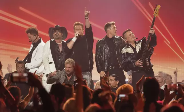 Joe Don Rooney, far left, AJ McLean, Gary LeVox, Nick Carter, and Jay DeMarcus perform during the 60th annual Academy of Country Music Awards on Thursday, May 8, 2025, in Frisco, Texas. (AP Photo/Chris Pizzello)