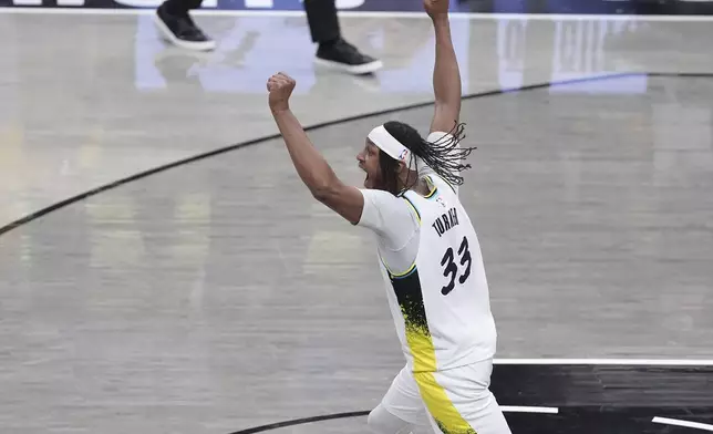 Indiana Pacers center Myles Turner (33) celebrates the team's win after overtime in Game 5 of an NBA basketball first-round playoff series against the Milwaukee Bucks in Indianapolis, Tuesday, April 29, 2025. (AP Photo/Michael Conroy)