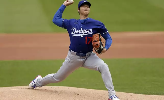 Los Angeles Dodgers' Shohei Ohtani (17), of Japan, throws live batting practice before a baseball game against the New York Mets on Sunday, May 25, 2025, in New York. (AP Photo/Adam Hunger)