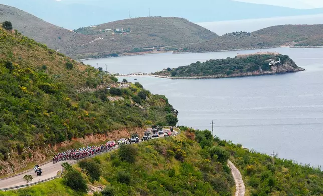 The pack rides during the third stage of the Giro d'Italia cycling race, from Vlore to Vlore, Albania, Sunday, May 11, 2025. (Fabio Ferrari/LaPresse via AP)
