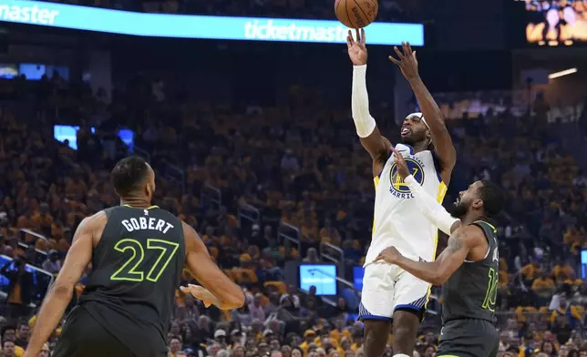 Golden State Warriors guard Buddy Hield (7) shoots next to Minnesota Timberwolves guard Mike Conley (10) during the first half of Game 3 of an NBA basketball second-round playoff series Saturday, May 10, 2025, in San Francisco. (AP Photo/Godofredo A. Vásquez)