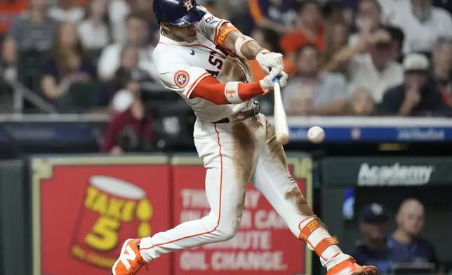 Houston Astros' Jeremy Peña (3) hits a single against Tampa Bay Rays starting pitcher Shane Baz during the fifth inning of a baseball game, Thursday, May 29, 2025, in Houston. (AP Photo/Karen Warren)