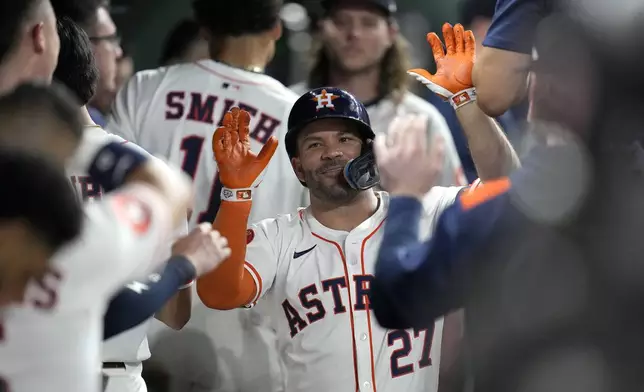 Houston Astros' Jose Altuve (27) celebrates his home run against Tampa Bay Rays starting pitcher Shane Baz during the sixth inning of a baseball game, Thursday, May 29, 2025, in Houston. (AP Photo/Karen Warren)