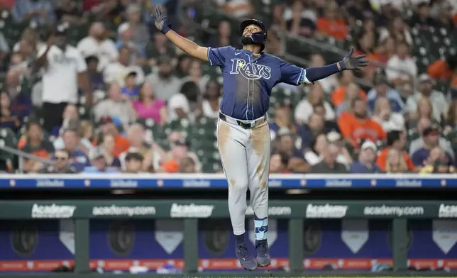Tampa Bay Rays' Junior Caminero (13) celebrates his three-run home run against Houston Astros relief pitcher Bryan King during the seventh inning of a baseball game, Thursday, May 29, 2025, in Houston. (AP Photo/Karen Warren)