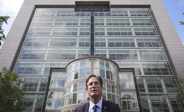 Los Angeles County District Attorney Nathan Hochman speaks to the media during a hearing in the case of Erik and Lyle Menendez Tuesday, May 13, 2025, in Los Angeles. (AP Photo/Damian Dovarganes)
