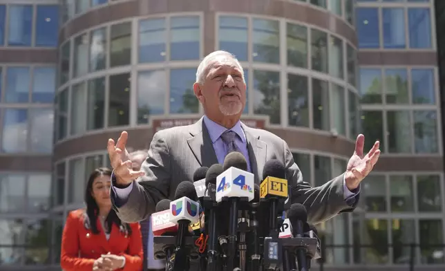 Attorney Mark Geragos, who represents Erik and Lyle Menendez, speaks to the media during break from the brothers' resentencing hearing Tuesday, May 13, 2025, in Los Angeles. (AP Photo/Damian Dovarganes)