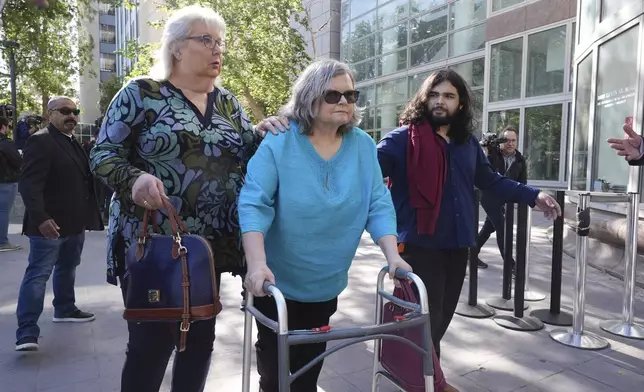 Family and supporters of Erik and Lyle Menendez arrive at court for a hearing in the brothers' case Tuesday, May 13, 2025, in Los Angeles. (AP Photo/Damian Dovarganes)