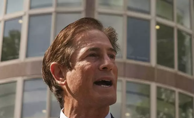 Los Angeles County District Attorney Nathan Hochman speaks to the media during a hearing in the case of Erik and Lyle Menendez Tuesday, May 13, 2025, in Los Angeles. (AP Photo/Damian Dovarganes)