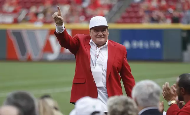 FILE - Former Cincinnati Reds player and guest Pete Ross acknowledges spectators during a Cincinnati Reds Hall of Fame induction ceremony before a baseball game against the Pittsburgh Pirates, Saturday, July 21, 2018, in Cincinnati. (AP Photo/John Minchillo, File)