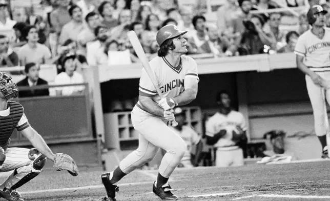 FILE - Cincinnati Reds' Pete Rose of the follows through after a long fly-out to the outfield during the first inning of a baseball game agains the New York Mets at New York's Shea Stadium, July 24, 1978. (AP Photo/G. Paul Burnett, File)