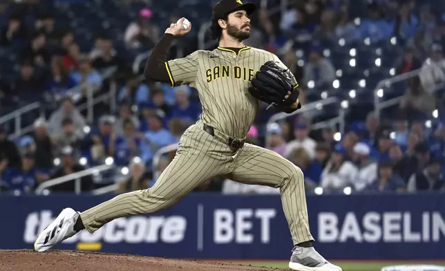 San Diego Padres starting pitcher Dylan Cease (84) throws to a Toronto Blue Jays batter during the first inning of a baseball game in Toronto on Tuesday, May 20, 2025. (Jon Blacker/The Canadian Press via AP)