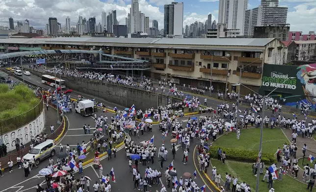 Students and teachers protest the government's decision to sign a memorandum of understanding on security cooperation with the U.S. that they believe violates their nation's sovereignty in Panama City, Tuesday, May 6, 2025. (AP Photo/Matias Delacroix)