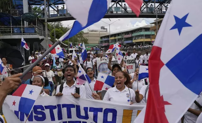 Students and teachers protest the government's decision to sign a memorandum of understanding on security cooperation with the U.S. that they believe violates their nation's sovereignty in Panama City, Tuesday, May 6, 2025. (AP Photo/Matias Delacroix)