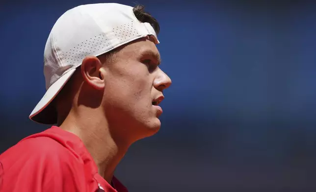 Denmark's Holger Rune looks on as he plays France's Quentin Halys during their third round match of the French Tennis Open, at the Roland-Garros stadium, in Paris, Friday, May 30, 2025. (AP Photo/Lindsey Wasson)
