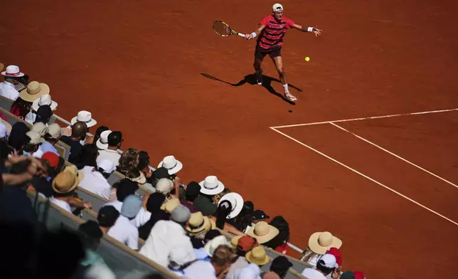 Denmark's Holger Rune returns the ball to France's Quentin Halys during their third round match of the French Tennis Open, at the Roland-Garros stadium, in Paris, Friday, May 30, 2025. (AP Photo/Thibault Camus)