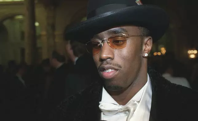 FILE - Nominated for four Grammy Awards, Sean "Puffy" Combs appears at Arista Records' pre-Grammy party in New York on Feb. 24, 1998, in New York. (AP Photo/Stuart Ramson)